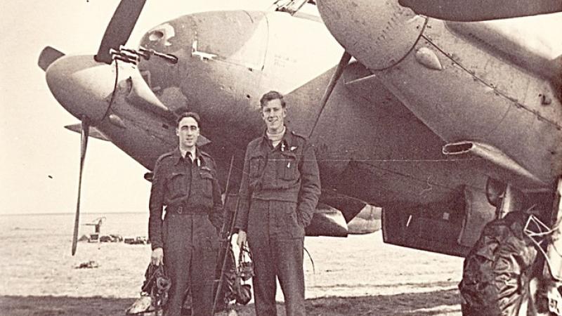 From left - Pilot Officer Justin Mulligan and Warrant Officer William Kinloch with a DeHavilland Mosquito fighter bomber in 1944.