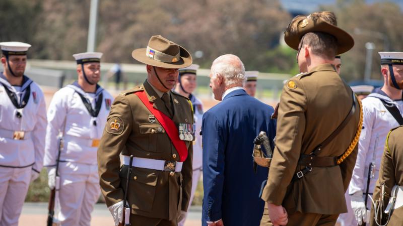 King Charles speaks to Warrant Officer Class 2 Damien Timms, of Australia's Federation Guard, at Parliament House.