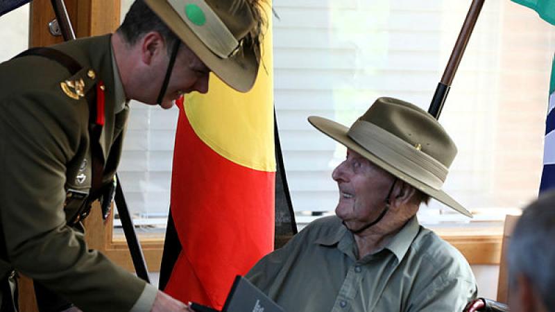 Commander 9th Brigade, Brigadier Tim Orders presents World War 2 veteran, Mr Glen Dobie, with his Australian Service Medal 1945-75 with Clasp 'PNG'.