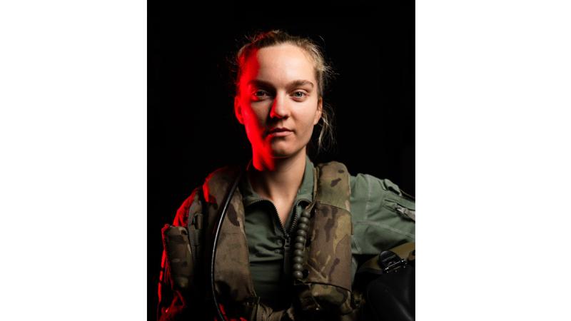 Leading Seaman Aircrewman Belinda Cole prepares for flying operations as the ship transits through the East Philippine Sea during Annualex 2023.