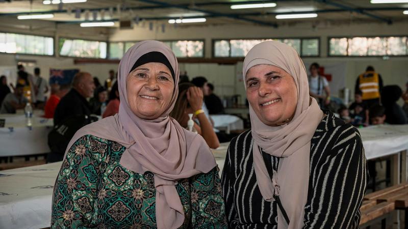 Sisters Houda Ammoun and Berriah Maghchouch wait at Cypriot National Guard Base KEN Larnaca, Cyprus, before returning to Australia.