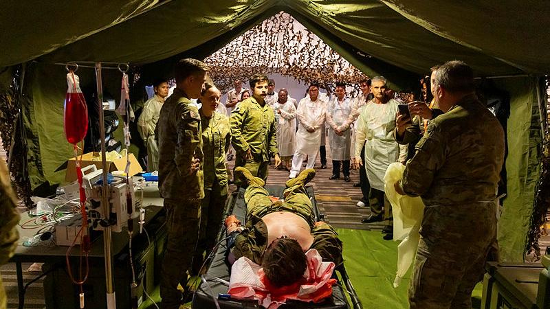 Attendees of International Committee of Military Medicine's 45th World Congress take part in a military medicine workshop.