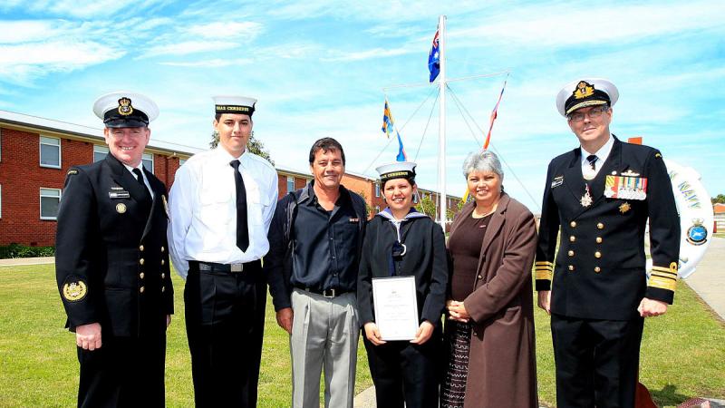Leading Seaman Erin Ashworth with her family and then Chief of Navy Vice Admiral Ray Griggs at her graduation in 2013.