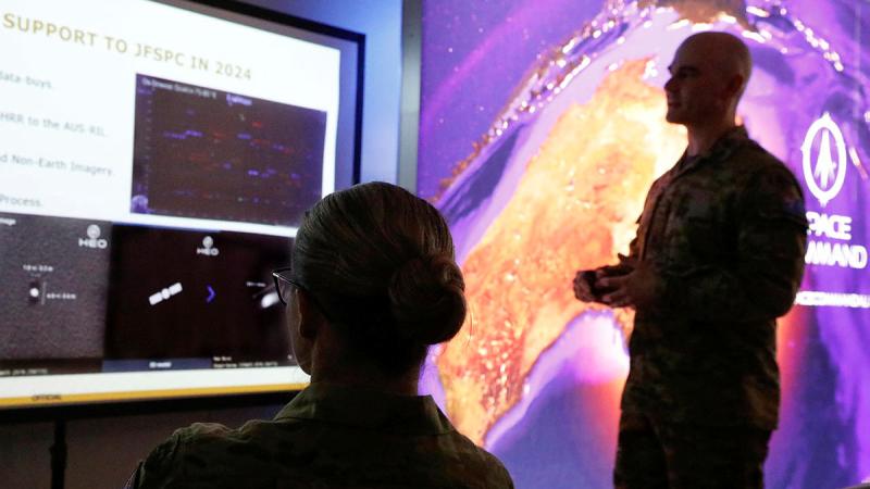 Army's Major Thomas Bittner briefs ADF Chief of Joint Capabilities Lieutenant General Susan Coyle in the Air Force Space Command Operations Centre during Exercise Pitch Black this year. 