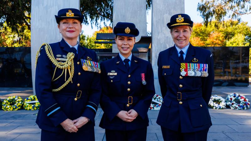 Enlisted Aviator of the Year Award recipient Corporal Kbora Ali, centre, stands with Air Vice-Marshal Barbara Courtney and Air Commodore Ruth Elsley after the commemorative service for the 103rd anniversary of the formation of the RAAF, held in Canberra earlier this year.