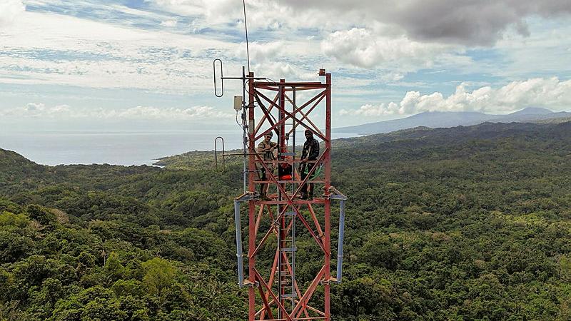 Australian Army Signaler Nicholas Lister, left, from 1st Signal Regiment and Corporal Luke Lini, from the Vanuatu Mobile Force conduct maintenance on Epi Tower on Epi Island.