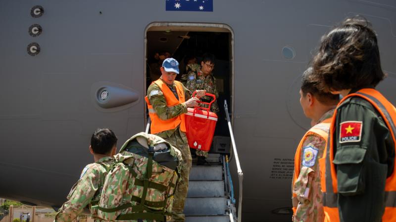 UN peacekeeper, RAAF Flight Lieutenant Grant Soutar, helps People’s Army of Vietnam UN peacekeepers unload cargo from a RAAF 36 Squadron C-17 Globemaster at Juba International Airport, South Sudan.