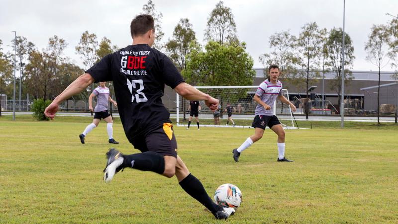 An Army soldier prepares to shoot for goal during the Army Football Championships at Gallipoli Barracks. 