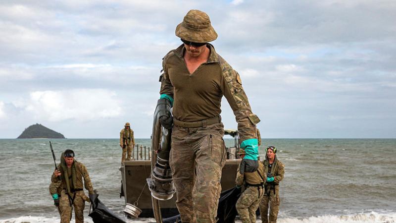 Army Petroleum Operator, Private Mason Dearing, prepares to transport fuel from an LCM-8 to the Beach Storage Area in the vicinity of Cowley Beach Training Area, Queensland.