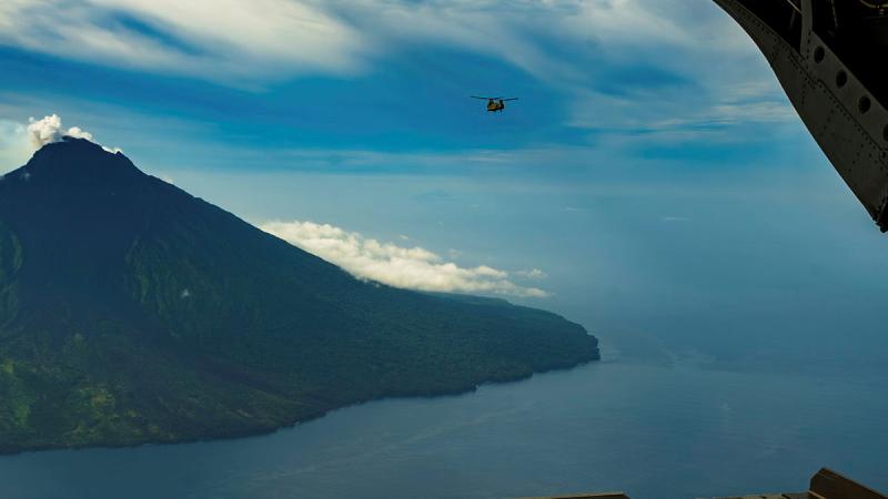 A CH-47F Chinook from 5th Aviation Regiment flies over Karkar Island, during Exercise Helicon Luk in Papua New Guinea. 