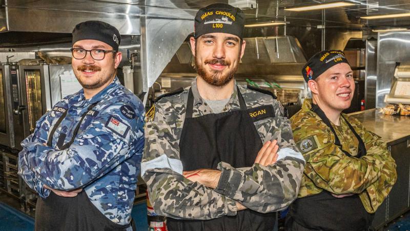 Corporal Daniel Wilson, left, Able Seaman Hunter Morgan and Lance Corporal Jaidyn Ivers in the galley on board HMAS Choules.