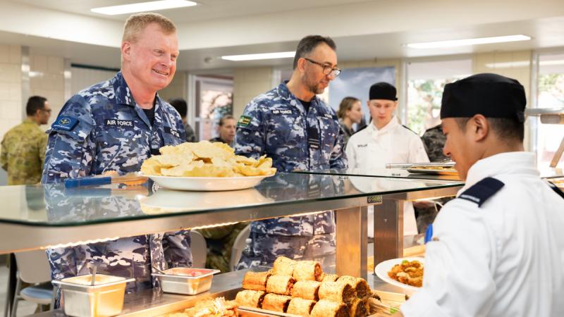 Warrant Officer of the Air Force, Ralph Clifton chats with staff during a visit to the ADF School of Catering at HMAS Cerberus, Victoria.