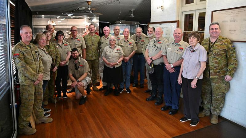 (Centre) Commander of 7th Brigade Brigadier Giles Cornelius with members of Australian Army History unit and volunteers at Victoria Barracks Brisbane, Queensland. 