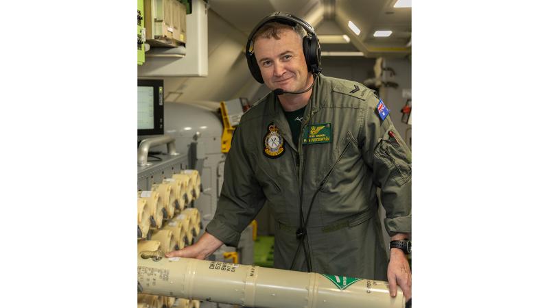 RAAF Corporal Bryce Gregory checking an AN/SSQ-53D DIFAR Sonobuoy during Exercise Keen Sword. 