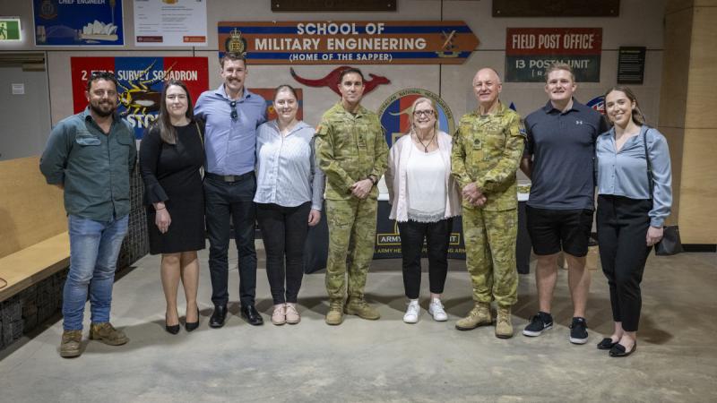 Warrant Officer Class One Frank Franolic (right of centre), standing with friends and family, was presented with his third Federation Star by the Chief of Army.