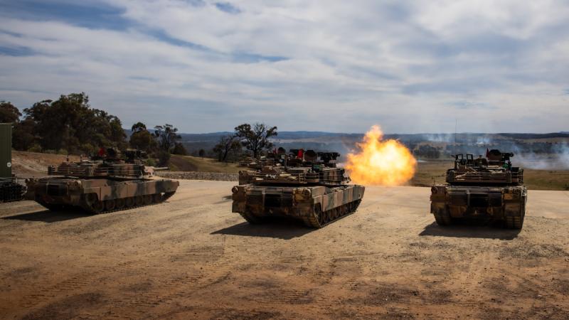 Australian Army Abrams M1A2 SEPv3 main battle tanks during a live-fire serial as part of a qualification course for Royal Australian Armoured Corps soldiers at Puckapunyal Military Area, Victoria.