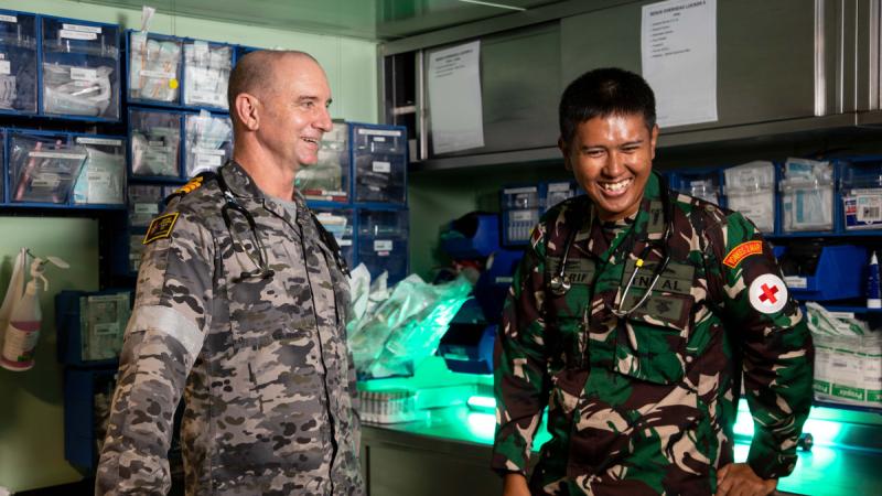 The Royal Australian Navy’s Director of Clinical Services Commander Scott Squires, left, and First Lieutenant Syarif Hidayatullah, of the Indonesian National Armed Forces, participate in Exercise Keris Woomera on HMAS Adelaide.