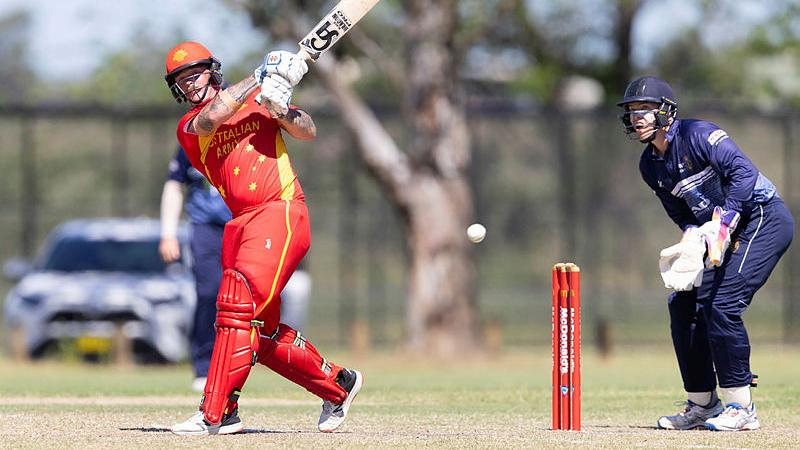 Australian Army Lance Corporal Andrew Sommerville strikes the ball during the ADF Cricket National Interservice Carnival in Richmond, NSW. 