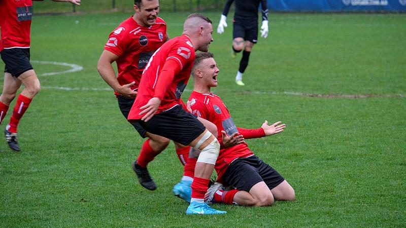 Australian Army football player Private Jake Cottam celebrates after scoring the Championship clinching goal versus Navy at the ADF Football Federation National Championships.