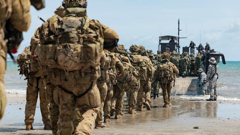 Australian Army soldiers and Singapore Armed Forces conduct a bilateral amphibious landing at Freshwater Beach in the Shoalwater Bay Training Area in Queensland, during Exercise Trident 2024. 