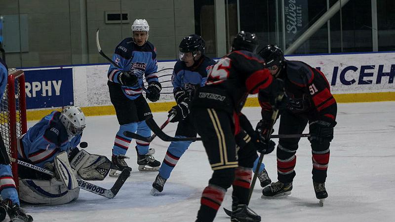 Air Force block a shot at goal from Army during the ADF Ice Hockey Associations Tri-Service Tournament in Melbourne.
