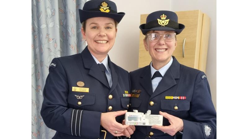 Wing Commander Amanda Norris and Warrant Officer Tanya Fraser with the syringe driver.