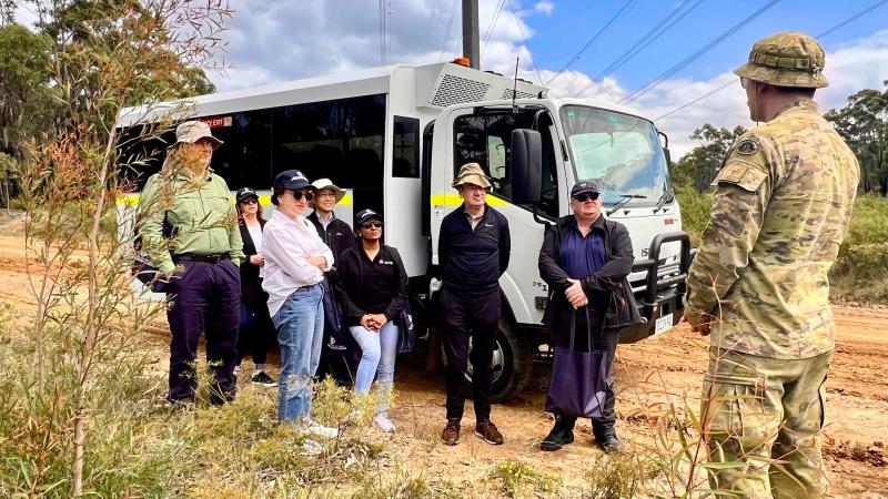 Captain Chris O'Sullivan explains the pressures of building mental and physical resilience in Army Reserve training to university staff and industry leaders during Sydney University Regiment's community engagement program. 