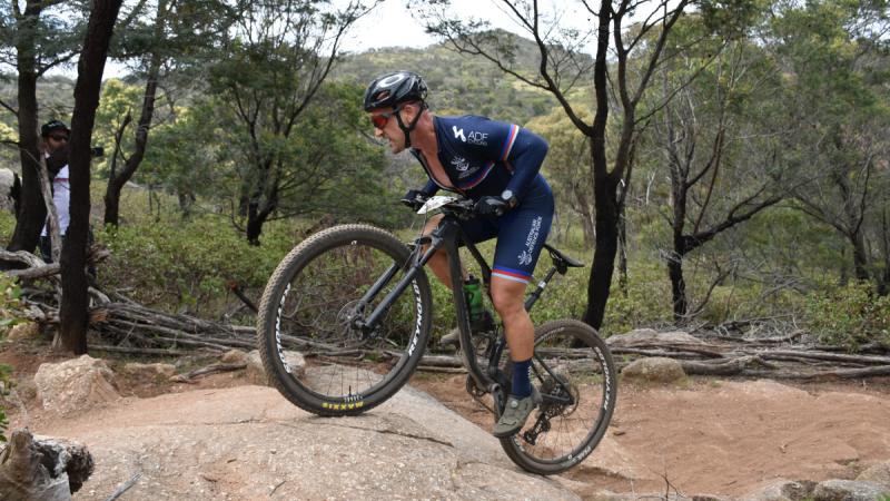 Chief Petty Officer Cameron Schmid competes in the cross-country Olympic race at You Yangs Regional Park, Victoria, during the ADF National Cycling Carnival.
