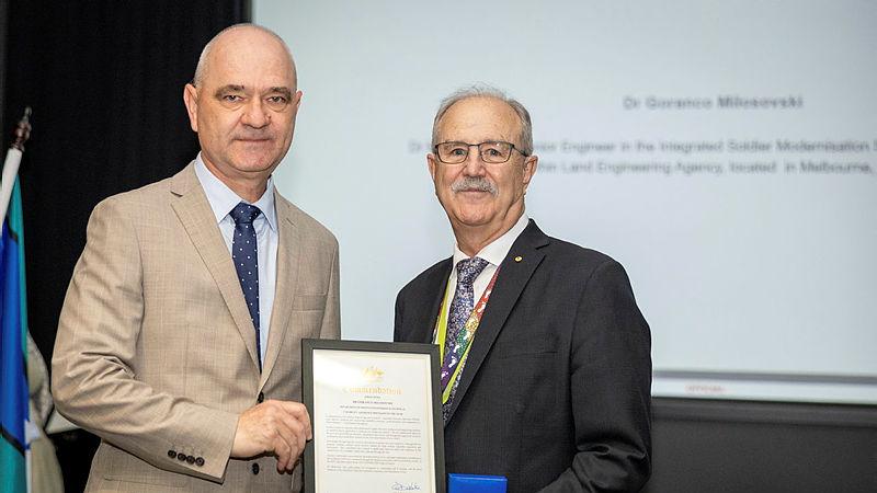 Dr Goran Milosovski accepts the Capability Assurance Specialist of the Year from Deputy Secretary Capability Acquisition and Sustainment Group Mr Christopher Deeble at the annual Engineering Technical awards.