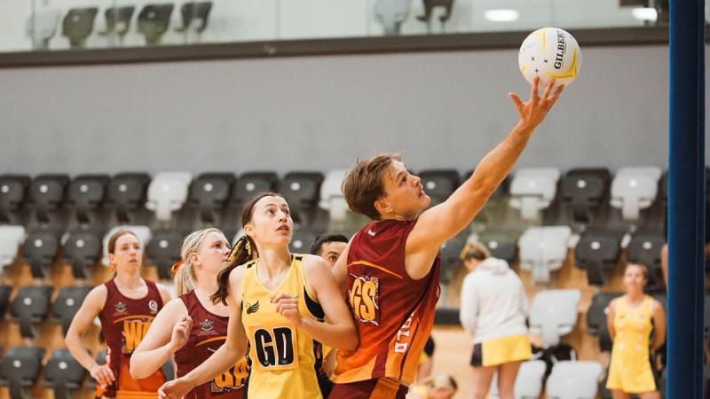 South East Queensland player Leading Aircraftsman Thomas Quinn catches the ball during his game against WA at the ADF Combined Netball Tournament in Melbourne.