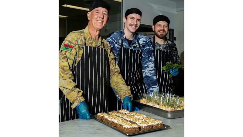 ADF Chefs, (L to R) Private Pieter Jongkryg, Aircraftman William Lindsay and Able Seaman Chris Lyne preparing dessert at the RAAF Base Amberley Mess. 