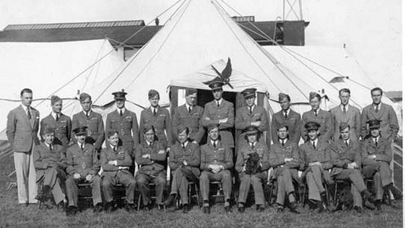 Members of Royal Air Force 601 Squadron with the Flying Sword overhead at a summer camp at RAF Lympne in 1937. 