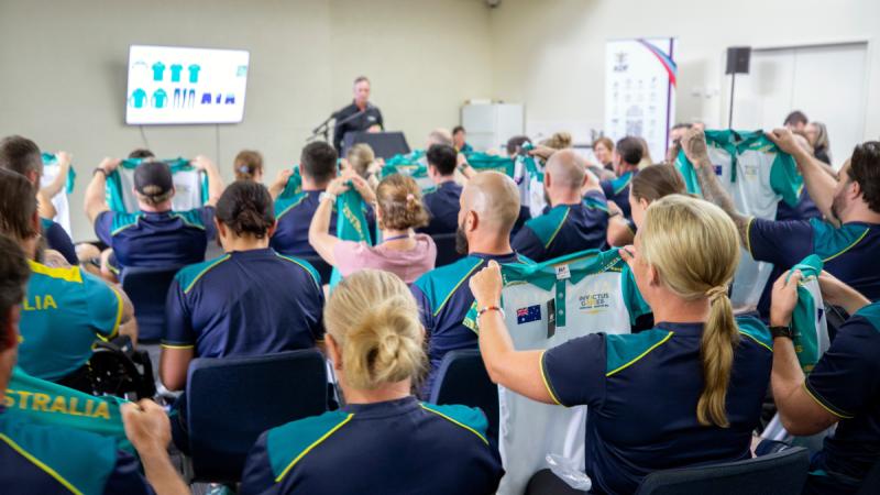 The Invictus Games 2025 Team Australia competitors receive the new team polo shirt during a uniform unveiling event at the Australian Institute of Sport, Canberra.