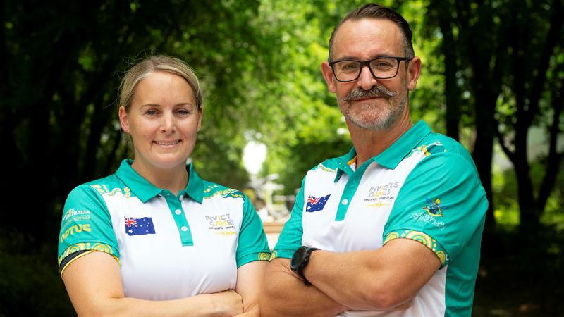 Invictus Games 2025 Team Australia captains, Caz Gladysz and Doug Griffiths proudly wear the new team polo shirt. 