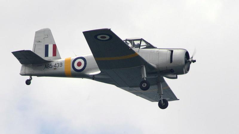 Wing Commander Aarian Birch pilots his CAC Winjeel from 100 Squadron at Point Cook, over the cliffs of Point Addis during the 80th Commemoration of the ditched RAAF Mitchel Bomber in 1944. 