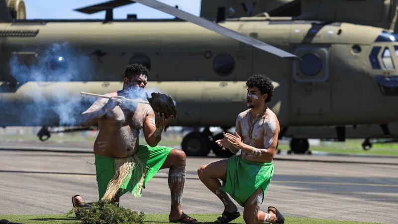 The Wulgurukaba people perform a smoking ceremony at the 5th Aviation Regiment naming ceremony of four CH-47F Chinook helicopters coming into operational service at RAAF Base Townsville, Queensland. 