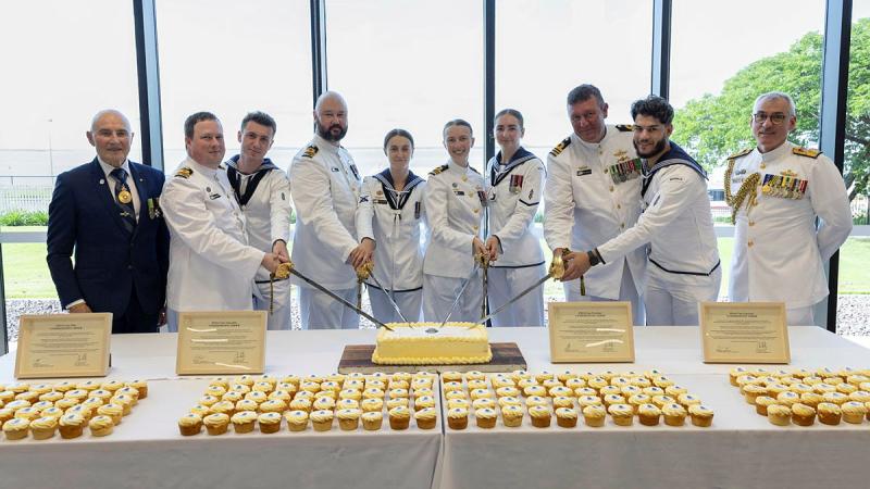 The Administrator of the NT, Professor Hugh Heggie, and Commander Australian Fleet, Rear Admiral Christopher Smith, with the commanding officers and the youngest sailors of HMA Ships Cape Pillar, Cape Naturaliste, Cape Woolamai and Cape Capricorn, cut the commissioning cake following a multi-ship commissioning ceremony at HMAS Coonawarra in Darwin.