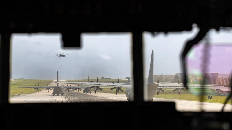 Aircraft from participating countries, including RAAF, line up on the runway for an elephant walk during Operation Christmas Drop 24.