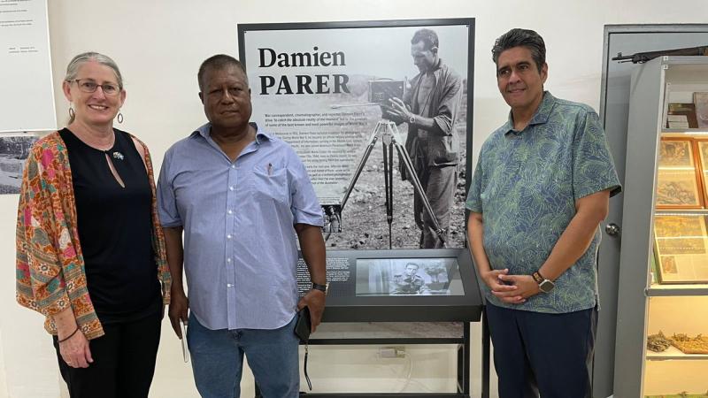 Ambassador to the Republic of Palau Richelle Turner, left, with the Governor of Peleliu Emais Roberts and Republic of Palau President Surangel Whipps Jr, at an exhibition of the life of Damien Parer.