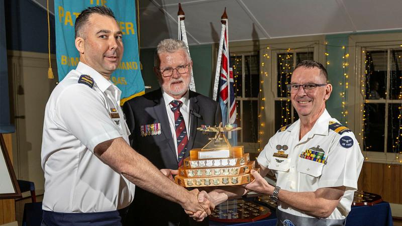The Aircrew Aviator of the Year award was presented to Sergeant Grant Vaughan (right) by Commander Air Mobility Group Air Commodore Bradley Clarke and Jett McClenaughan from the Pathfinder Association, at the Air Mobility Group Pathfinder Awards Dinner.
