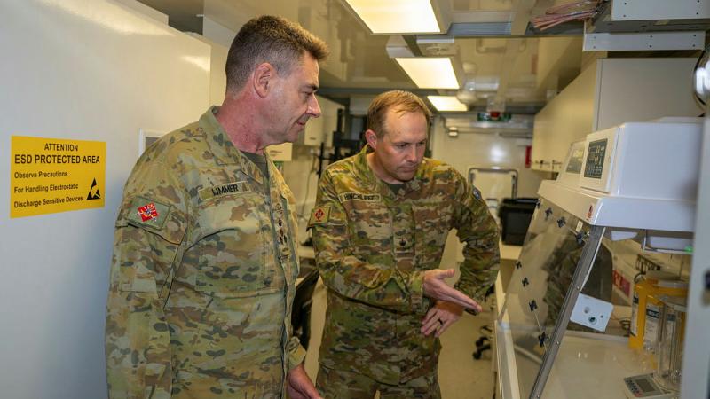 Major Gerard Hinchliffe from 1st Intelligence Battalion gives Commander 6th Brigade,Brigadier Deane Limmer, a tour of the Level 2 material exploitation facility at Gallipoli Barracks, Enoggera. 