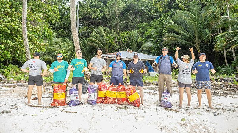 Crew of the ADV Reliant pose for a photo near Koror State Rock Islands Southern Lagoon, Palau after a beach clean-up activity during a visit in November 2024. 