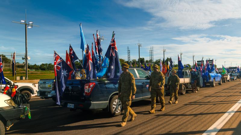 Army soldiers from the 1st Brigade inspect the vehicles on display during the 24th annual Hot 100 Australia Day Ute Run in Darwin, NT.