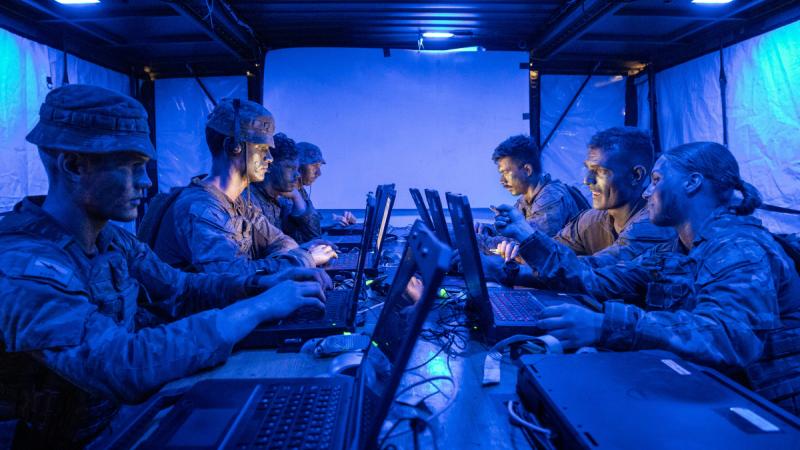 Soldiers and officers of Headquarters 3rd Brigade and the 3rd Combat Signal Regiment operate a command post during Exercise Brolga Walk, Townsville Field Training Area, Queensland, 2024.