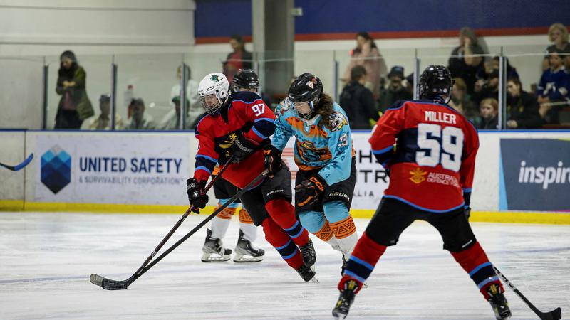 ADF Storm Ice Hockey team member Captain Joseph Chilvers (left) plays against Sydney Kodiaks in the Challenge Cup tournament at Hunter Ice Skating Stadium, NSW.