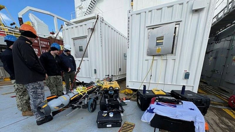 Sailors from Australia, America and the UK on deck during a trilateral exercise in Norfolk Virginia.