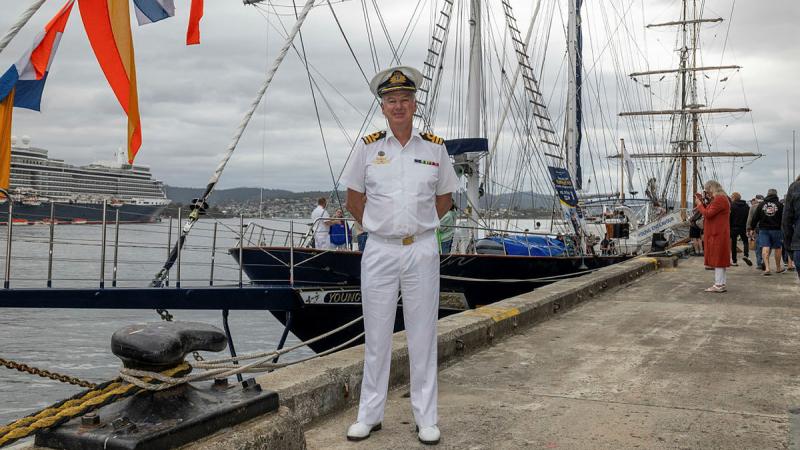 Young Endeavour Youth Scheme Project Manager, RAN Commander Gavin Dawe, stands on Princes Wharf in view of STS Young Endeavour during the 2025 Royal Hobart Regatta. 