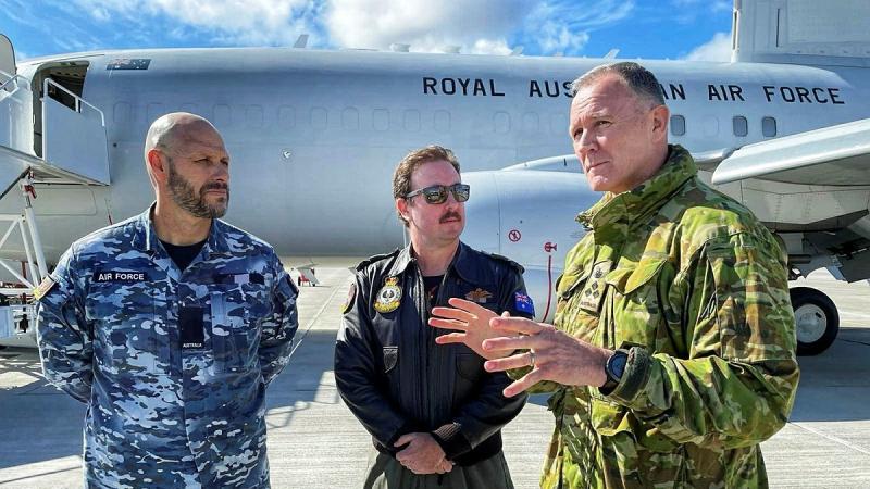 Head of Australian Defence Staff - London, Brigadier Grant Mason, right, stands with Air Force crew in front of an E-7A Wedgetail aircraft at RAF Lossiemouth in Scotland, after a six-month deployment to Europe as part of Operation Kudu.