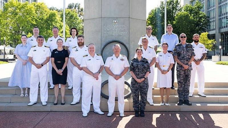 Military Public Affairs Officers in naval uniform gather outside Russell Offices, Canberra, to celebrate becoming Navy's newest employment category.