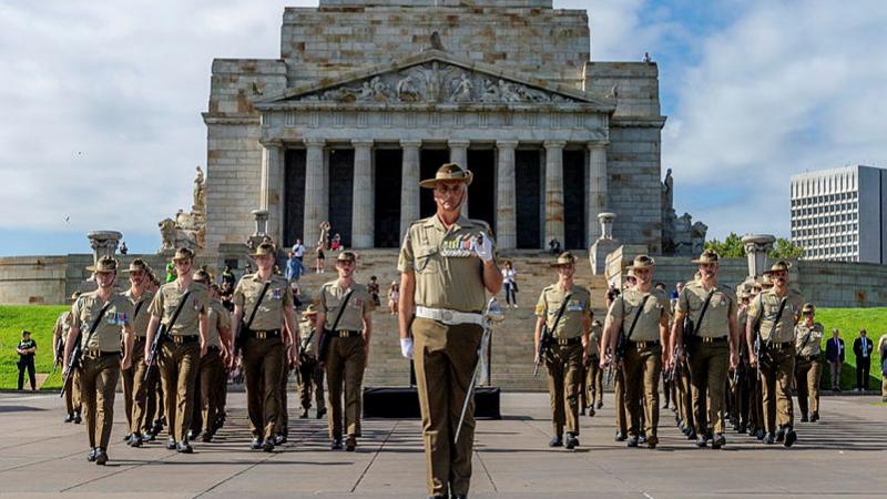 Regimental Sargent Major of the Defence Force School of Signals, Warrant Office Class One Benn Goulter, orders signallers to "march on" at the start of a parade to celebrate the centenary of the Australian Corps of Signals in Melbourne.